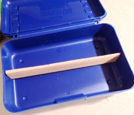 STEP 2: Cut the shim as measured so that it fits snugly across the length of the box.